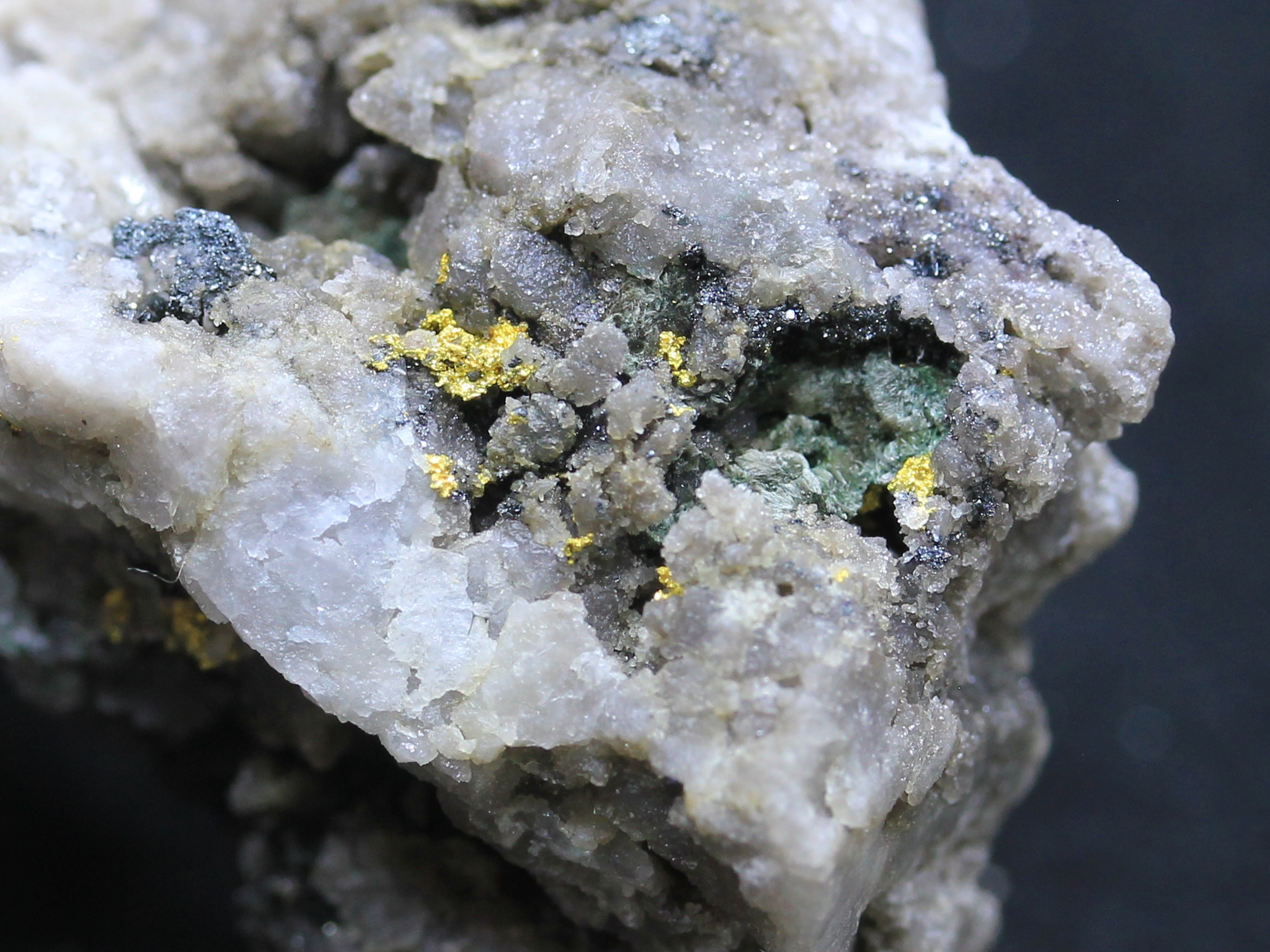Gold on quartz, bornite and malachite
