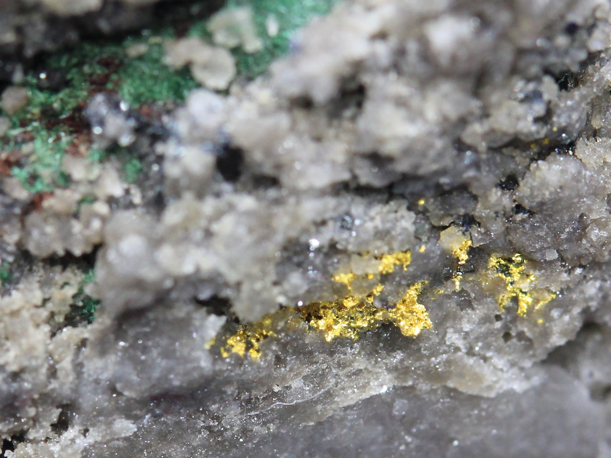 Gold on quartz, bornite and malachite
