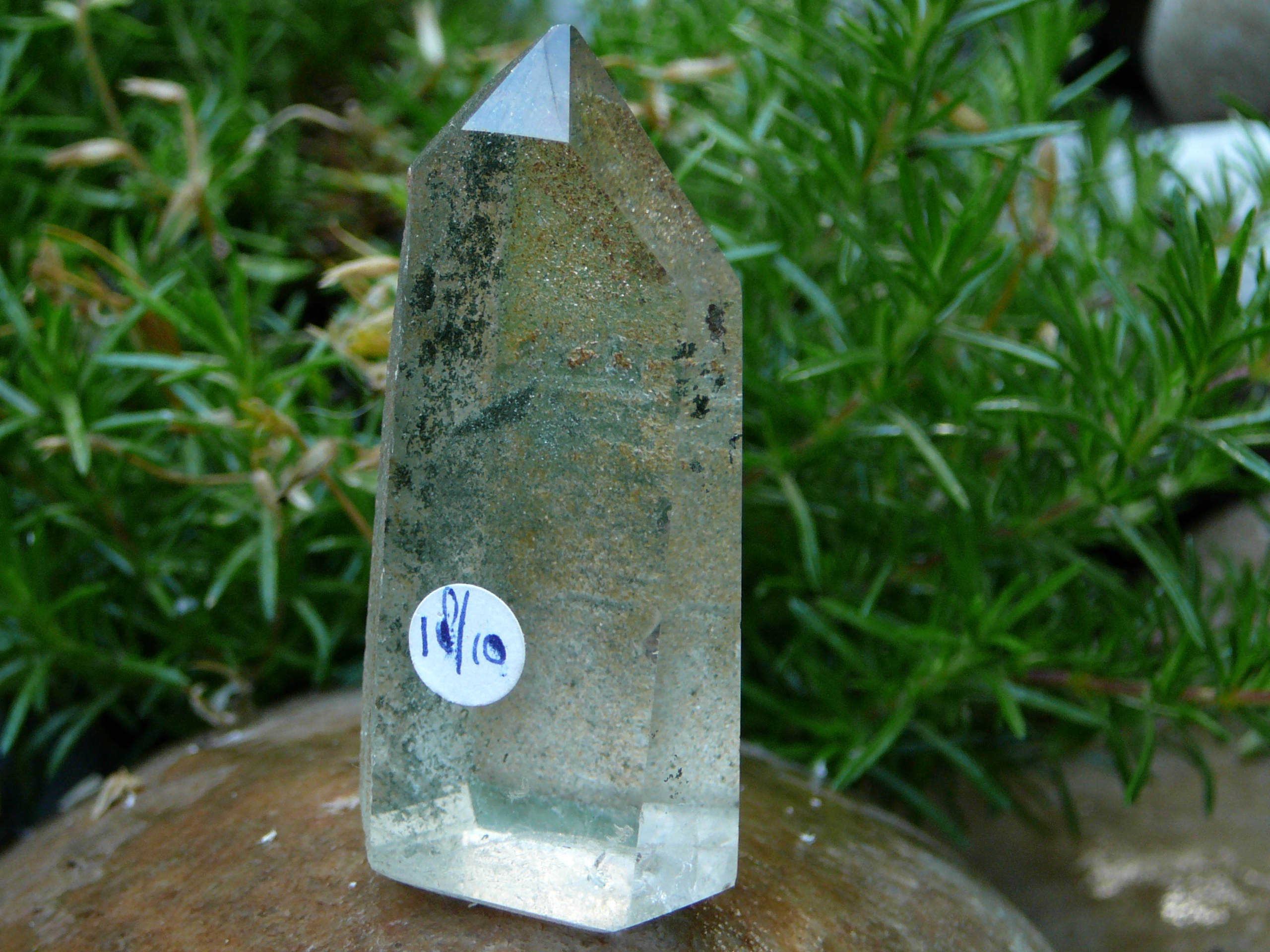 Partly polished crystal clear phantom quartz point