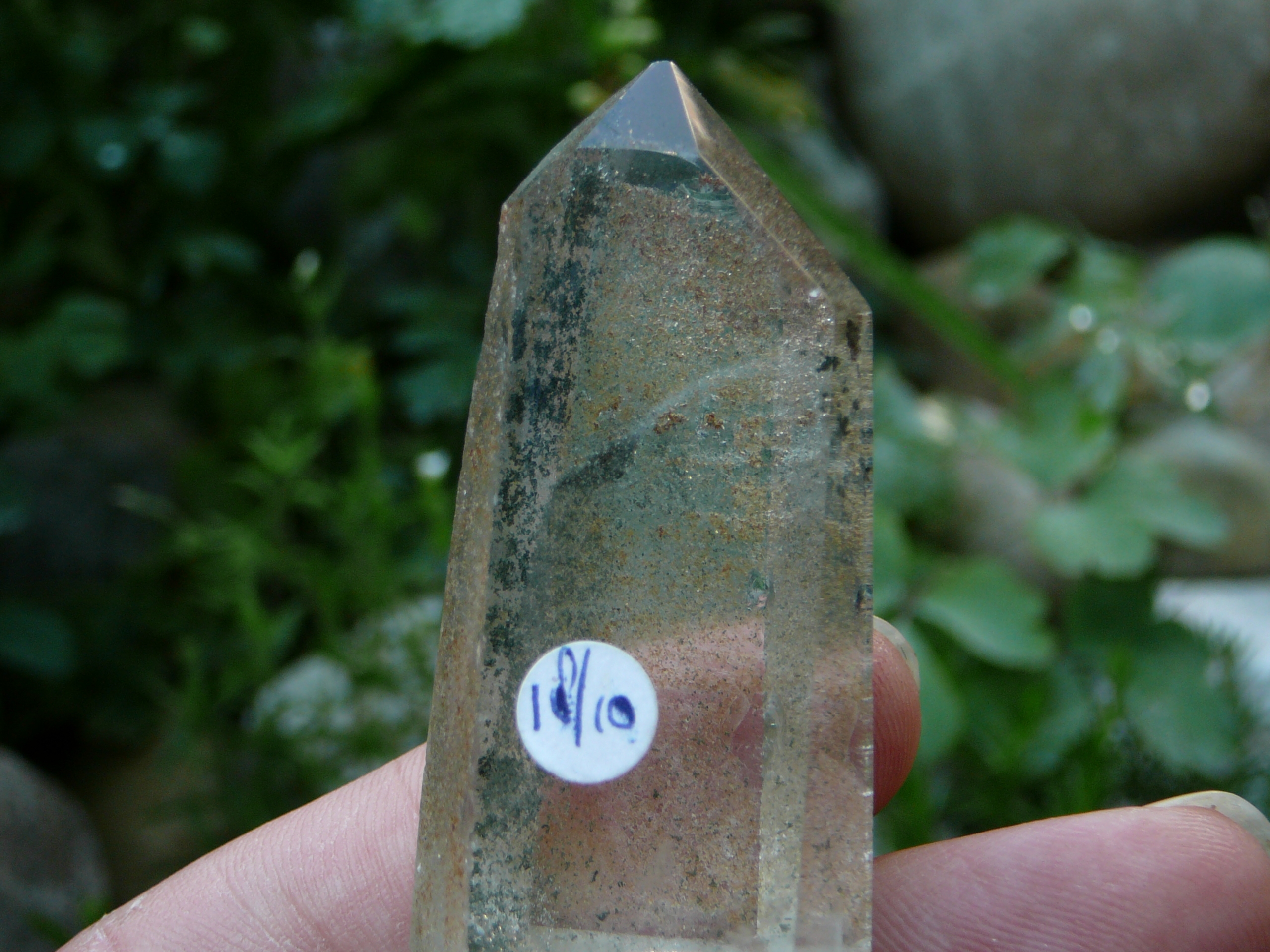 Partly polished crystal clear phantom quartz point