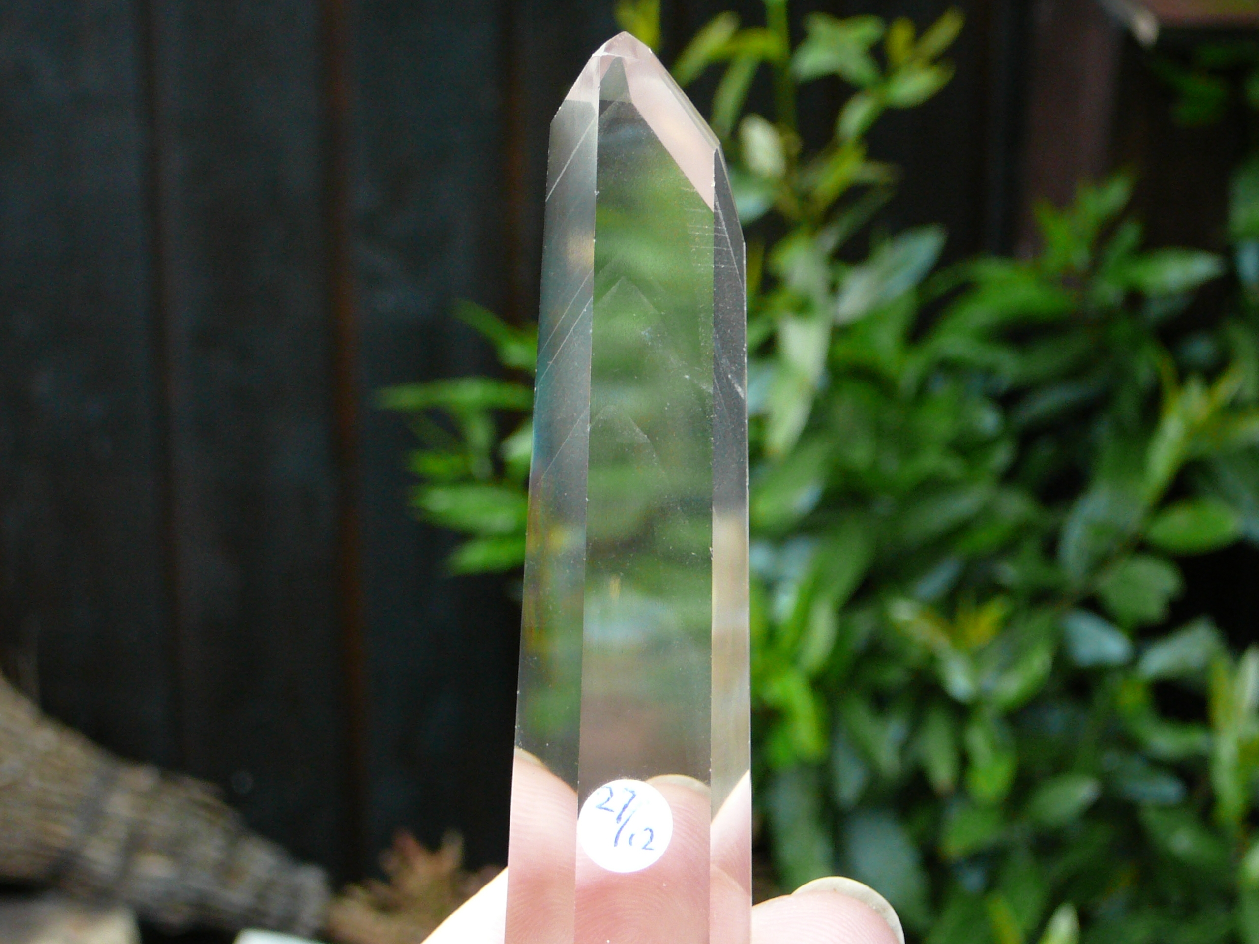 Polished crystal clear phantom quartz point